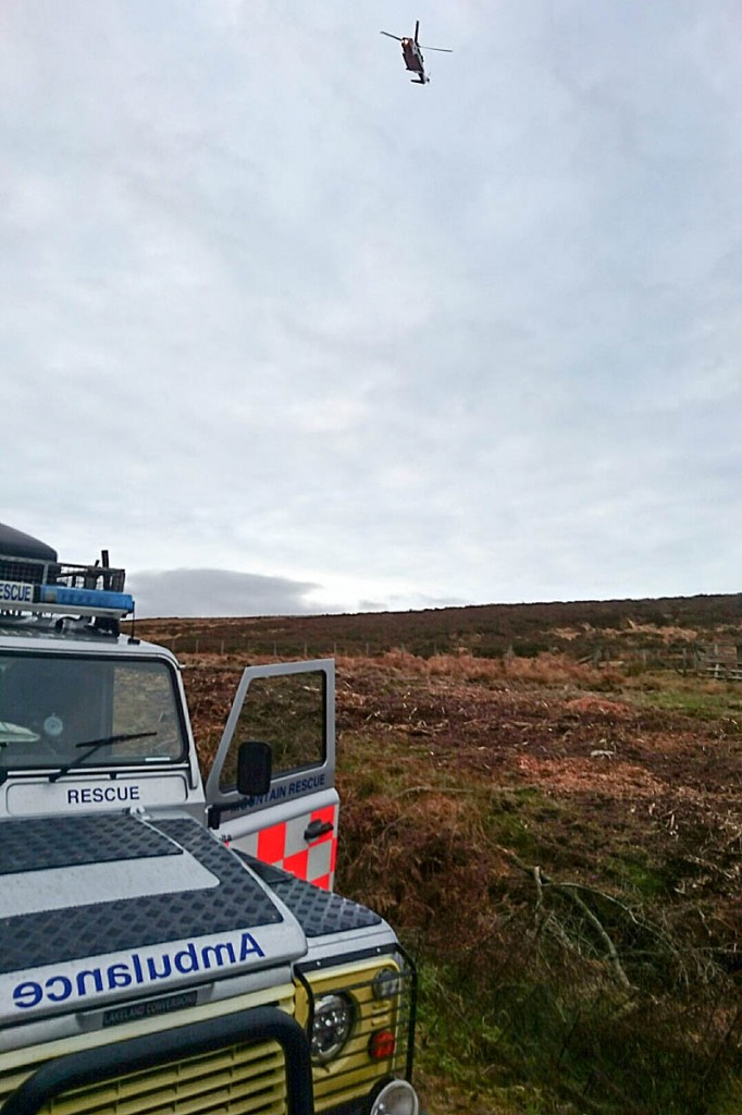 A mountain rescue Land Rover and the Coastguard helicopter at the scene. Photo: Northumberland National Park MRT