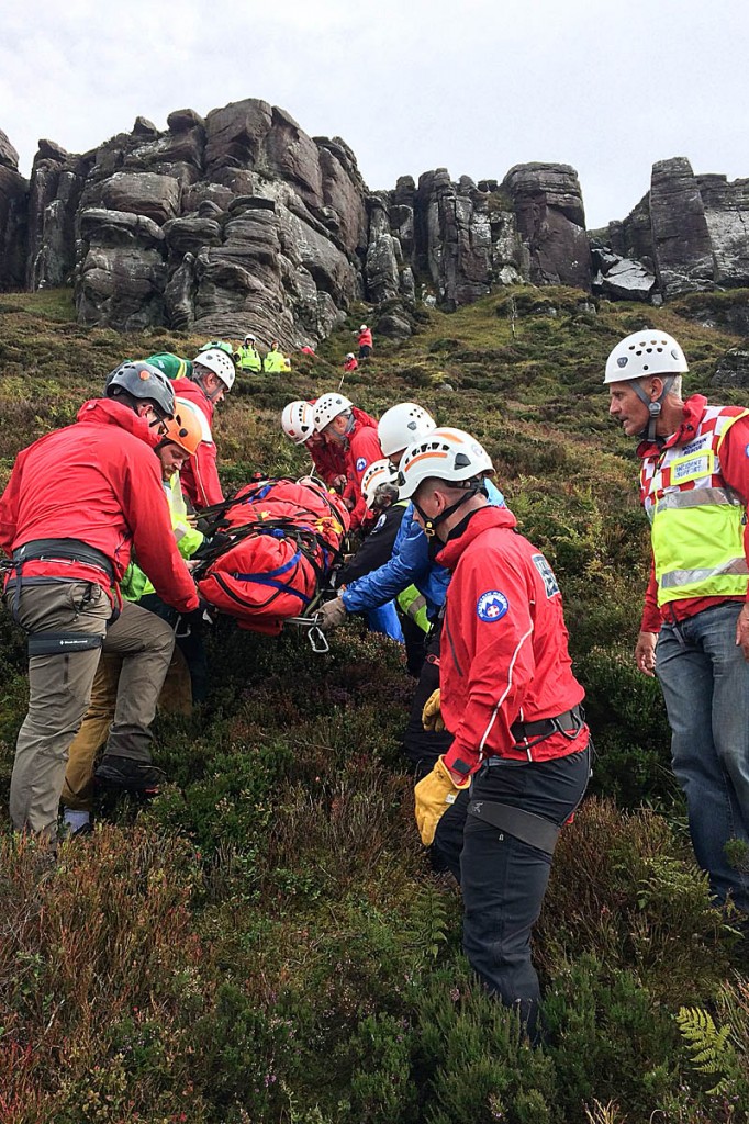 The injured climber is stretchered from the crag. Photo: NNPMRT The injured climber is stretchered from the crag. Photo: NNPMRT