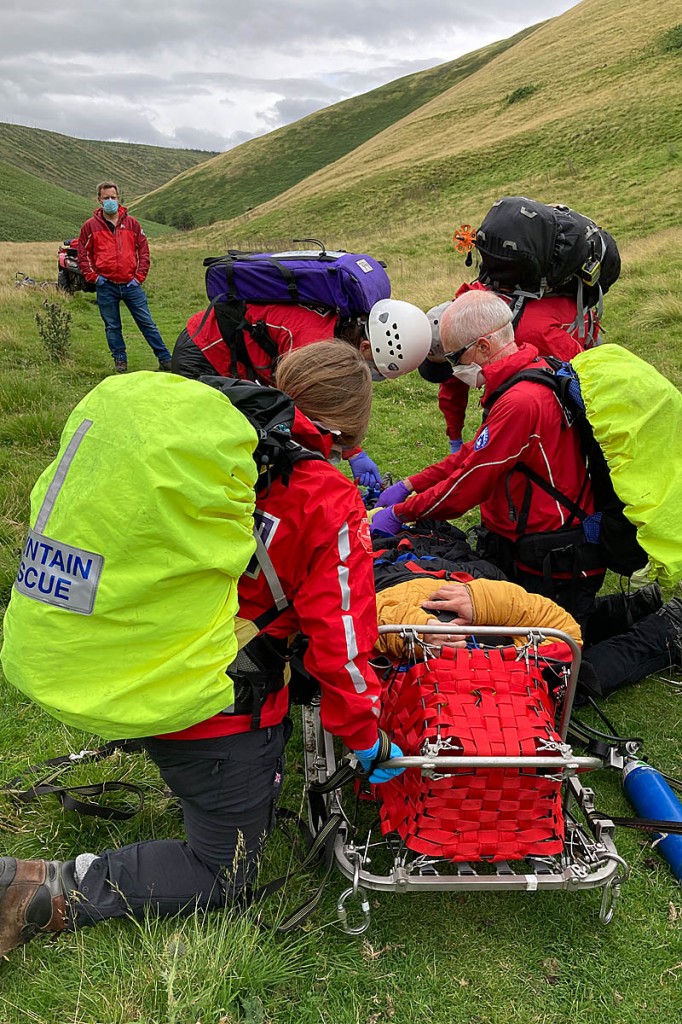 Rescuers tend to the mountain biker at Usway Burn. Photo: NNPMRT