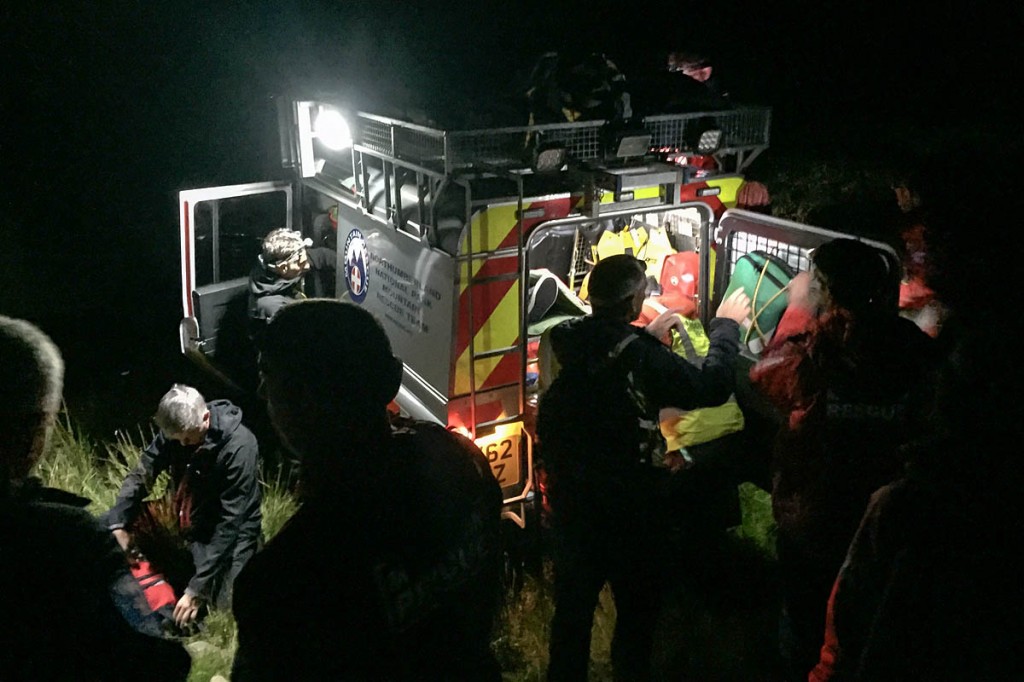 Rescuers load the injured walker into the Land Rover. Photo: Northumberland NPMRT