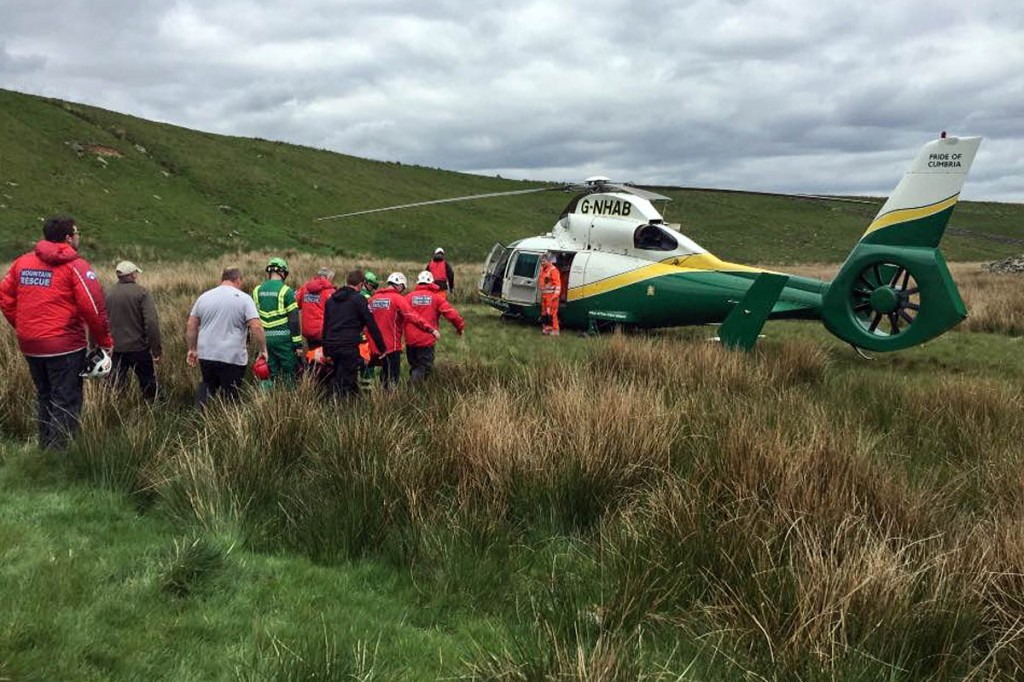 Rescuers stretcher the injured Peel Crag climber to the air ambulance. Photo: Northumberland NPMRT