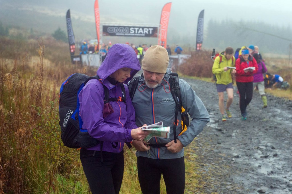 Team members plan their route at the run's start. Photo: OMM Team members plan their route at the run's start. Photo: OMM
