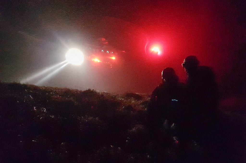 Team members with the Coastguard helicopter during the Monday rescue. Photo: Karl Lester/OVMRO Team members with the Coastguard helicopter during the Monday rescue. Photo: Karl Lester/OVMRO