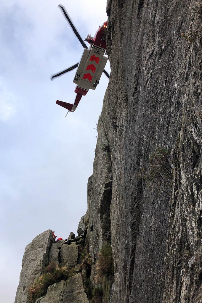 The Coastguard helicopter at the rescue scene. Photo: Ogwen Valley MRO The Coastguard helicopter at the rescue scene. Photo: Ogwen Valley MRO