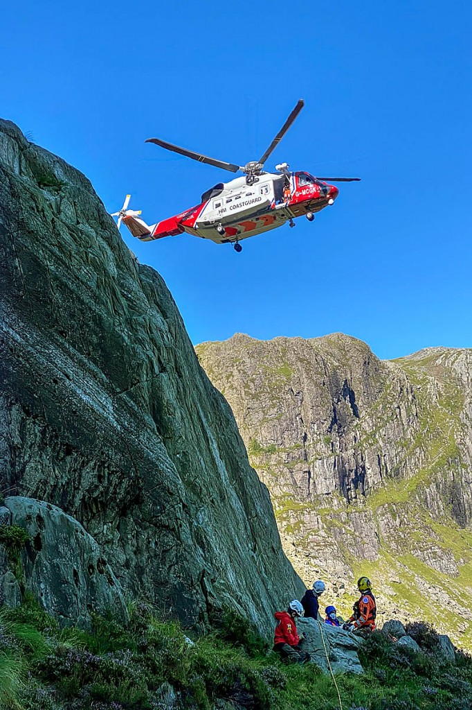 Rescuers and the Coastguard helicopter at the rescue site on Glyder Fawr. Photo: OVMRO Rescuers and the Coastguard helicopter at the rescue site on Glyder Fawr. Photo: OVMRO