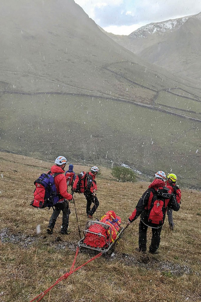 Rescuers used a rope system while sledging the stretcher down the fellside. Photo: Patterdale MRT Rescuers used a rope system while sledging the stretcher down the fellside. Photo: Patterdale MRT