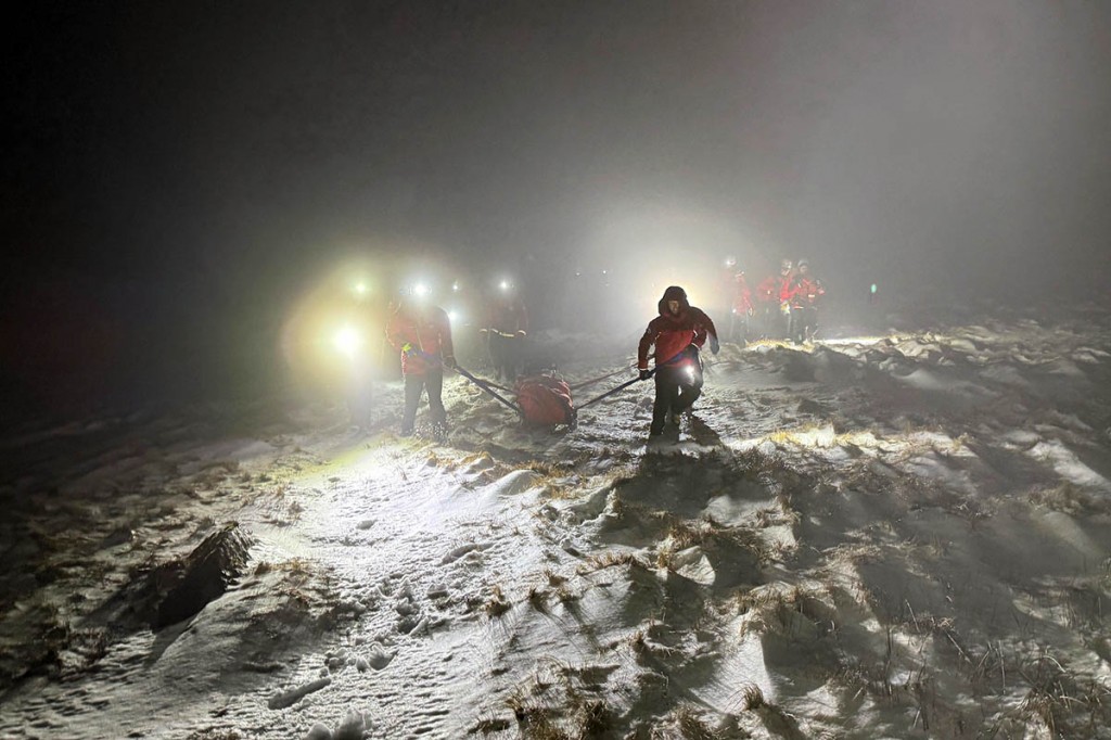 Rescuers stretcher the injured man down the mountainside. Photo: Patterdale MRT