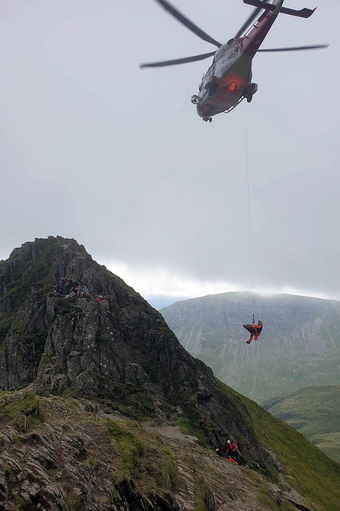 The injured walker is winched into the Coastguard helicopter. Photo: Patterdale MRT