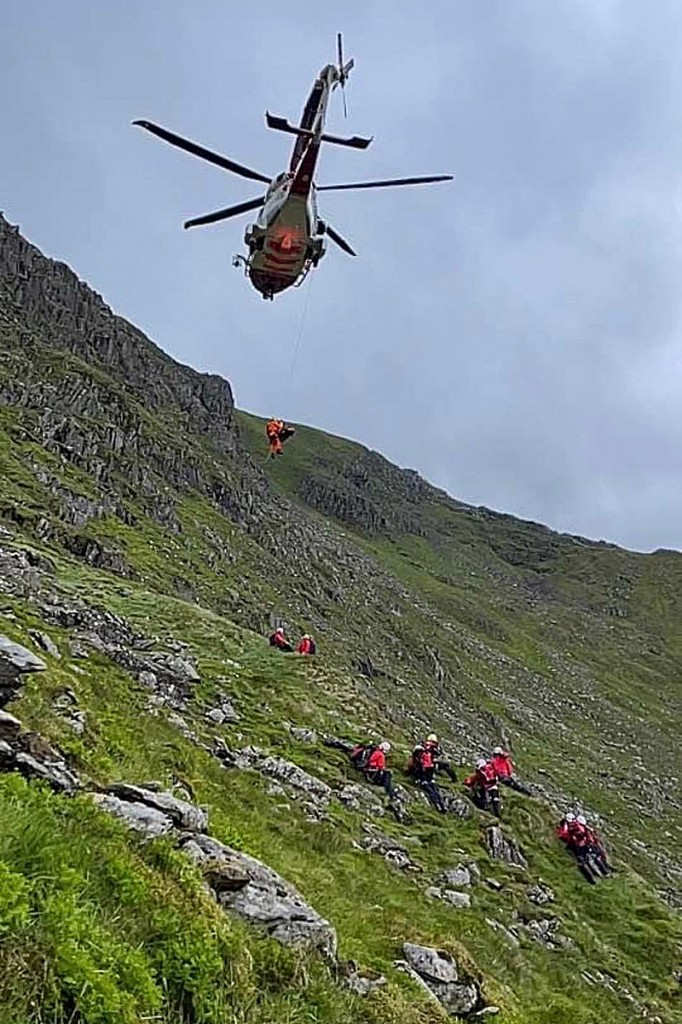 The Coastguard helicopter and rescuers at the scene on Helvellyn. Photo: Patterdale MRT The Coastguard helicopter and rescuers at the scene on Helvellyn. Photo: Patterdale MRT
