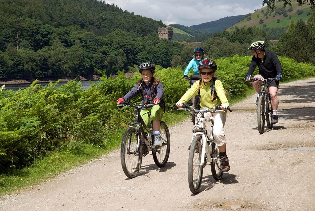 Cyclists enjoy the traffic-free reservoir-side route between Fairholmes and King's Tree Cyclists enjoy the traffic-free reservoir-side route between Fairholmes and King's Tree