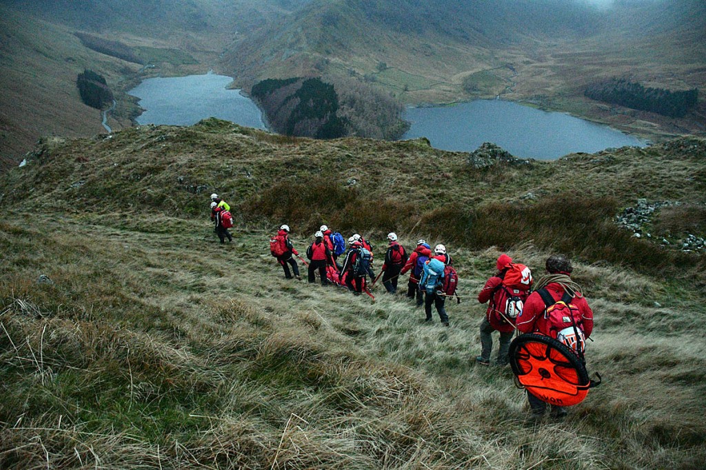 Team members stretcher the injured walker towards Haweswater. Photo: Paul Glasby