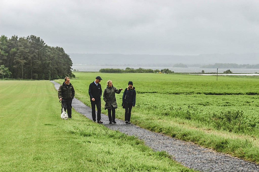 Walker Dave Alston and his terrier Murray join Roseanna Cunningham, Francesca Osowska and landowner Robin Niven near Loch Leven. Photo: Suzanne Moore