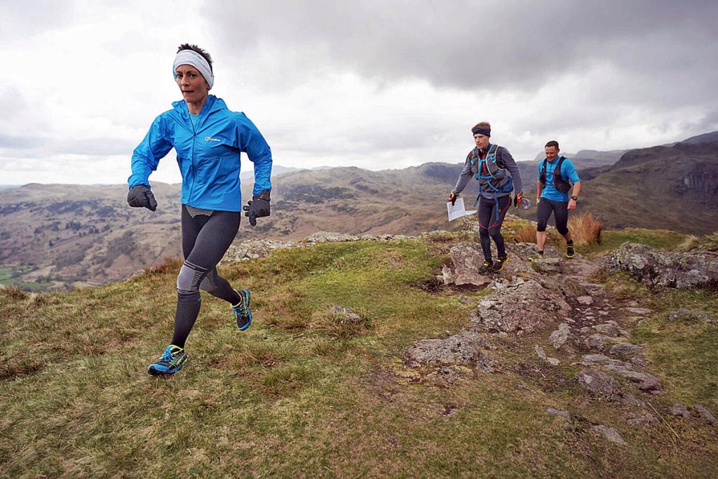 Sabrina Verjee descends Gibson Knott en route for Helm Crag, accompanied by pacers John Kelly and Ben Turner. Photo: Steve Ashworth Sabrina Verjee descends Gibson Knott en route for Helm Crag, accompanied by pacers John Kelly and Ben Turner. Photo: Steve Ashworth