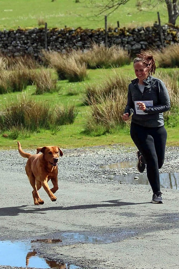 Leigh-Ann Newburn and Mac the dog take part in the relay. Photo: Tara Burns Photography Leigh-Ann Newburn and Mac the dog take part in the relay