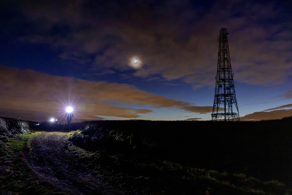 Runners pass the mast at Windy Hill as night falls on the first day. Photo: Bob Smith Photography
