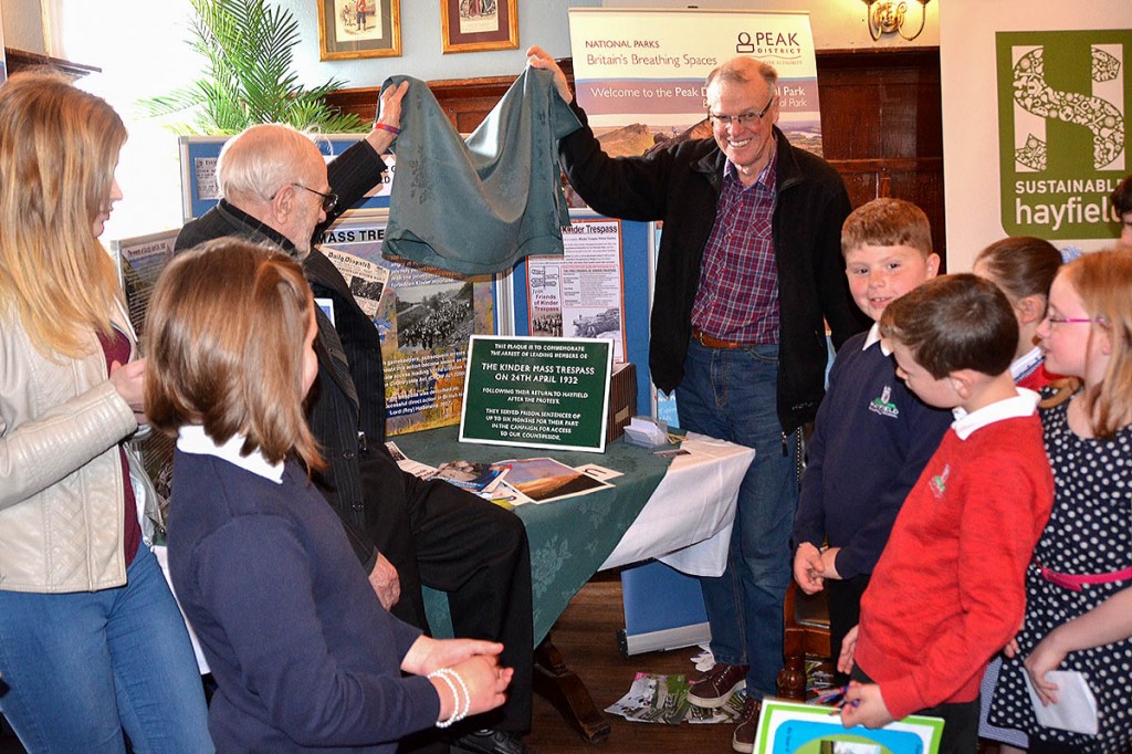 Alan Edwards, left, and Jan Gillett unveil the commemorative plaque, which will be placed on the outside wall of the Royal Hotel