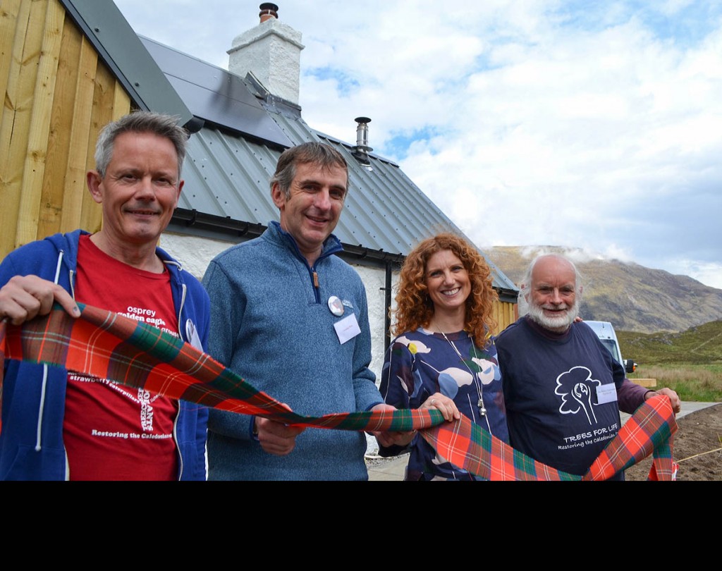 Reopening the bothy officially with the Clan Chisholm sash are, from left, Trees for Life chief executive Steve Micklewright; forest district manager Graeme Prest of Forest Enterprise Scotland; Vanessa Collingridge; Alan Watson Featherstone.