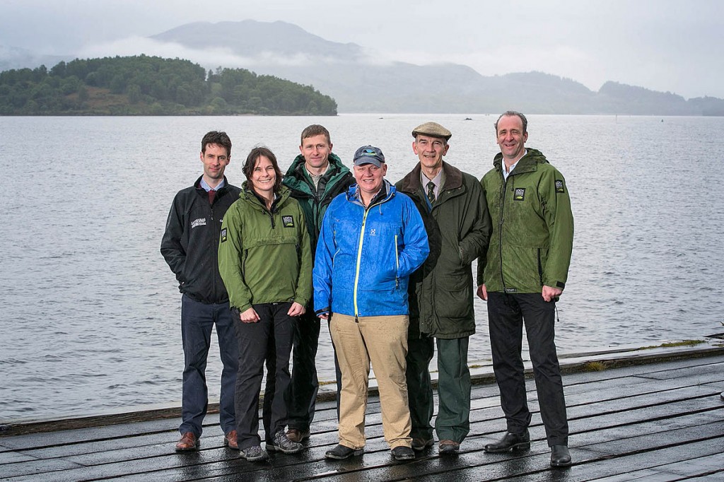 Celebrating the grant are: Hamish Trench, director of conservation and visitor experience at Cairngorms National Park Authority; Bridget Jones, head of visitor management at Loch Lomond & the Trossachs National Park Authority; Will Huckerby recreation manager at Forestry Commission Scotland; Dougie Baird, Cairngorms Outdoor Access Trust chief executive; trust chairman Peter Ord and Gordon Watson chief executive of Loch Lomond & the Trossachs National Park Authority. Photo: Michael McGurk