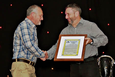 Simon Steer, right, chair of Scottish Mountain Rescue, presents the award to Allan McGee. Photo: David Williams/Reiver Photography Simon Steer, right, chair of Scottish Mountain Rescue, presents the award to Allan McGee. Photo: David Williams/Reiver Photography