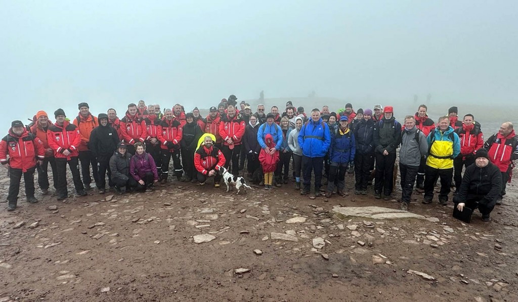Rescuers and supporters on the summit of Pen y Fan. Photo: Western Beacons MRT
