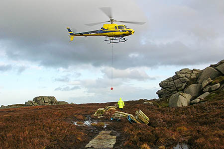 The helicopter in action on Simon's Seat. Photo: YDNPA `The helicopter in action on Simon's Seat. Photo: YDNPA