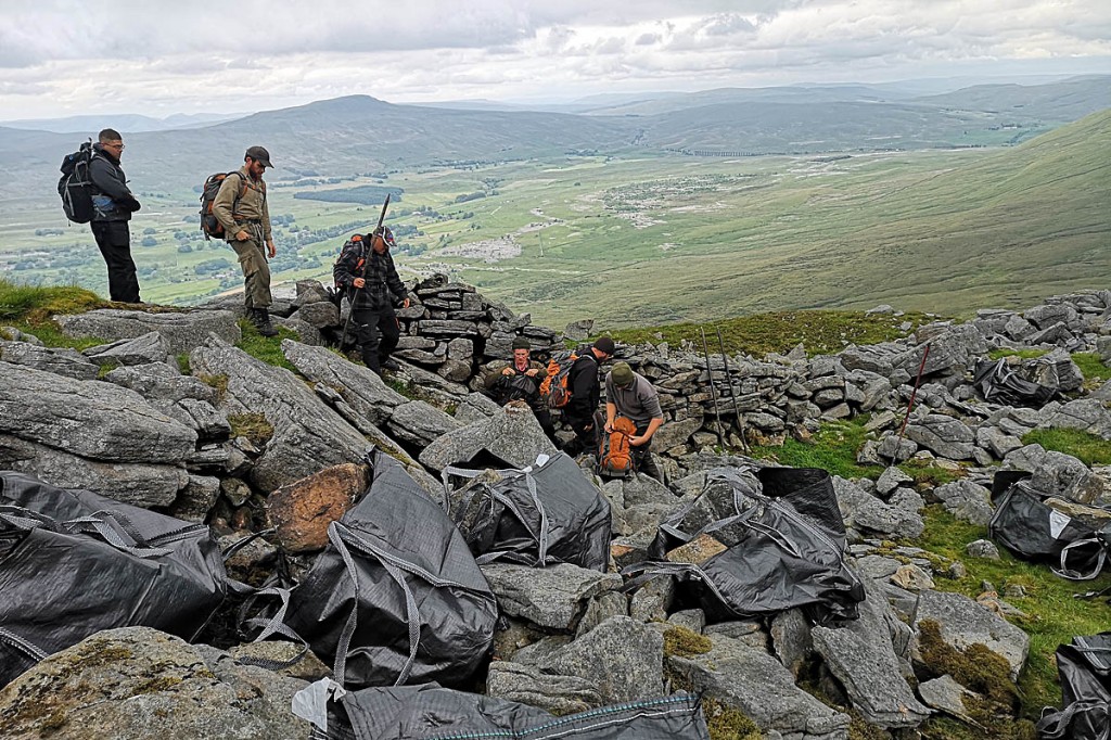 Gritstone blocks from a nearby scree slope have been picked and bagged. Photo: YDNPA