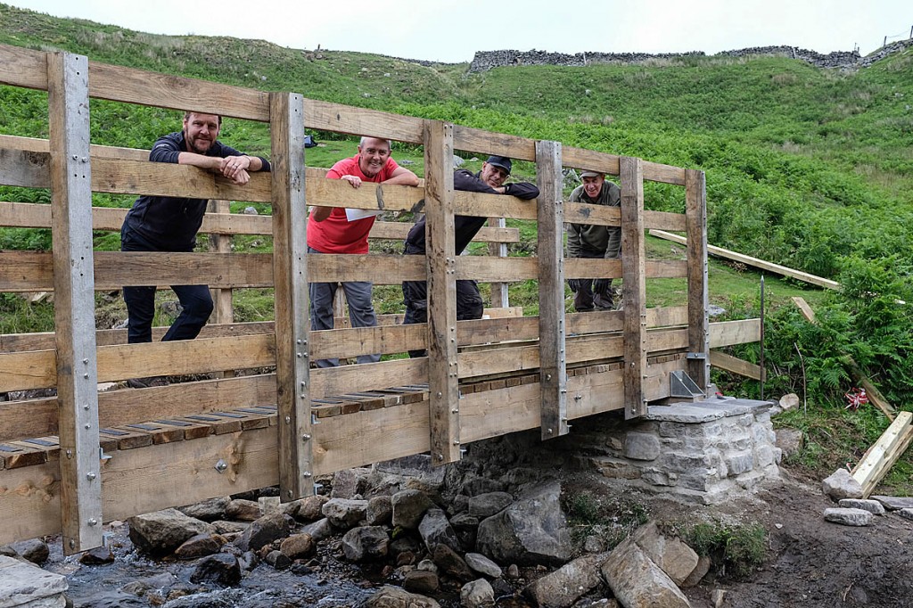 The new bridge with, from left, Michael Briggs, Tim Blenkin, access ranger Roger Foreman and Dales Volunteer David Fox