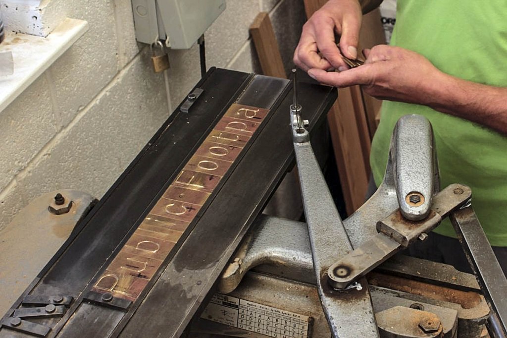 The brass blanks are loaded into the machine. Photo: Andrew Fagg/YDNPA The brass blanks are loaded into the machine. Photo: Andrew Fagg/YDNPA
