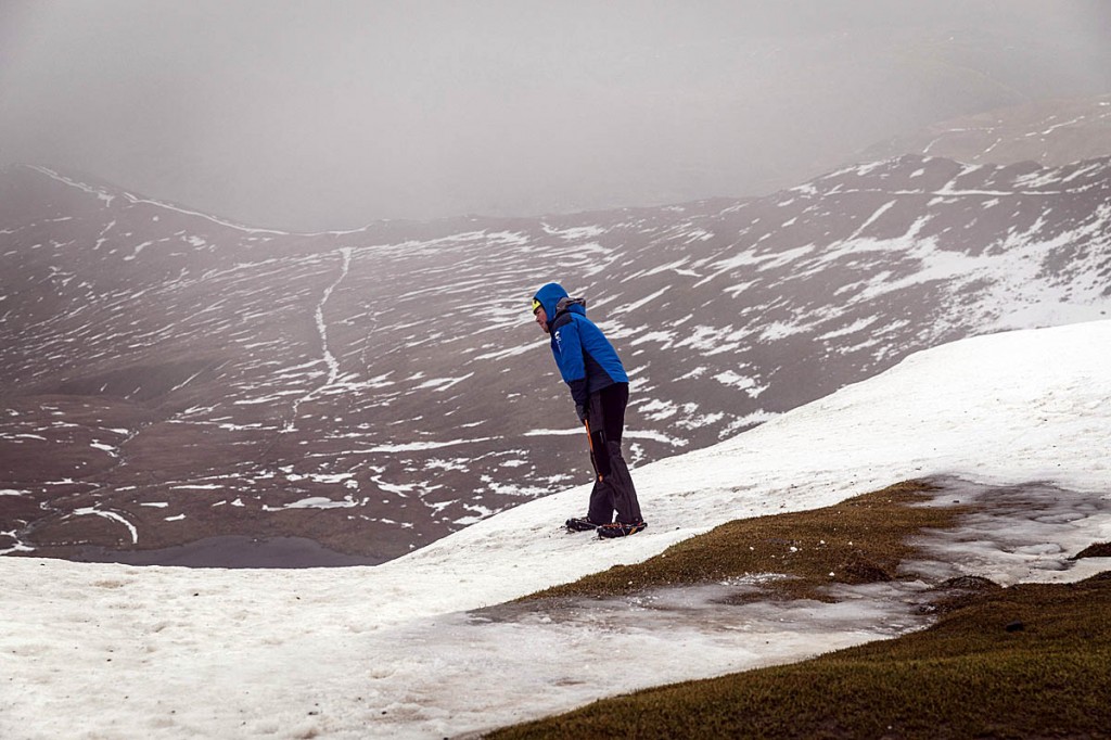 Zac Poulton checks the condition of a cornice on Helvellyn. Photo: Bob Smith/grough