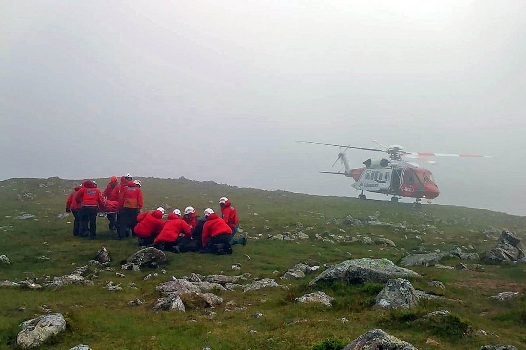 Rescuers and the Coastguard helicopter at the scene. Photo: Aberdyfi SRT