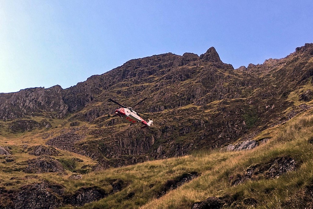 The Caernarfon Coastguard helicopter in Cwm Cau during the rescue. Photo: Aberdyfi SRT