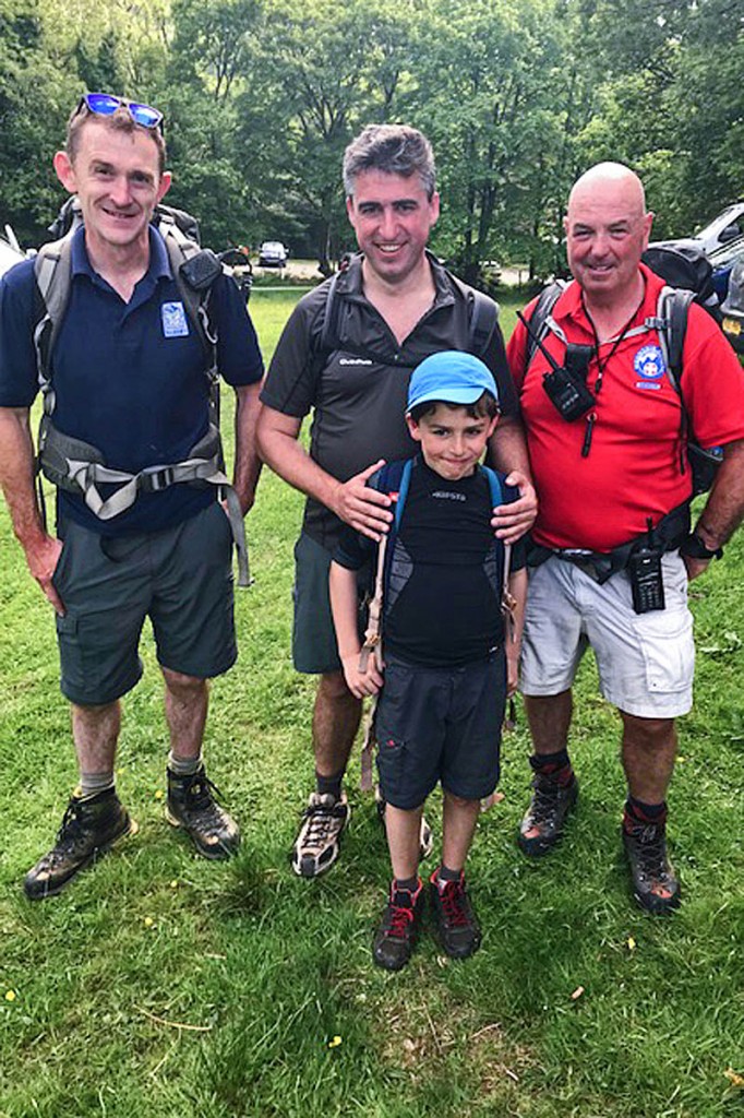 Father and son with Snowdonia national park ranger Gethin Corps, left, and Aberdyfi team volunteer Geoff Brittain. Photo: Aberdyfi SRT