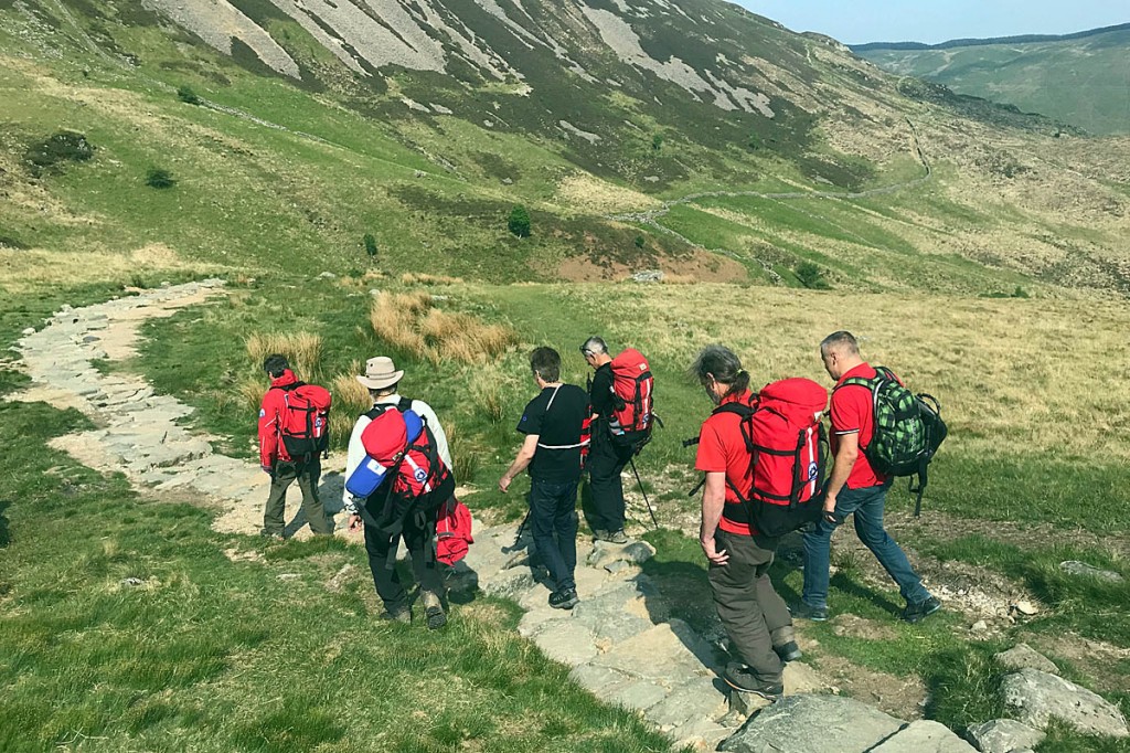 The injured walker is escorted down the Minffordd path. Photo: Aberdyfi SRT