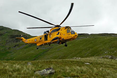 A Sea King helicopter from RAF Valley at the rescue scene on Yr Arddu. Photo: Aberglaslyn MRT A Sea King helicopter from RAF Valley at the rescue scene on Yr Arddu. Photo: Aberglaslyn MRT