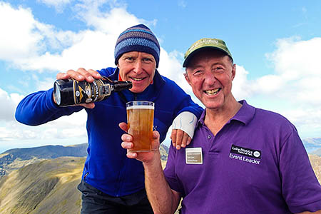 Alan Hinkes, left, toasts the anniversary on Great Gable with volunteer ranger David Tyson Alan Hinkes, left, toasts the anniversary on Great Gable with volunteer ranger David Tyson