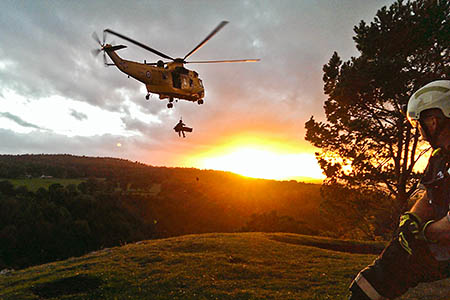 The injured climber is winched from the cliff at Goblin Combe. Photo: ASSAR The injured climber is winched from the cliff at Goblin Combe. Photo: ASSAR