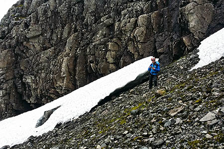 Geologist Jenny Ellis takes readings beside the August snowfields in Coire na Ciste. Photo: T Semple Geologist Jenny Ellis takes readings beside the August snowfields in Coire na Ciste. Photo: T Semple