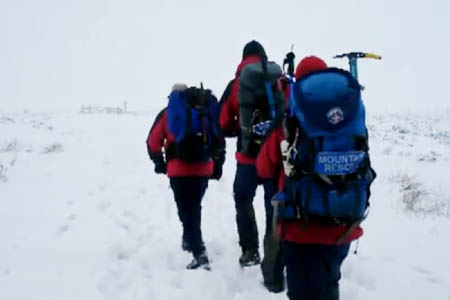 Kinder Mountain Rescue Team members on their way to help the collapsed man on Bleaklow