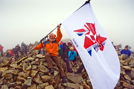 Sir Chris Bonington raises the Olympic flag on Scafell Pike's summit Sir Chris Bonington raises the Olympic flag on Scafell Pike's summit