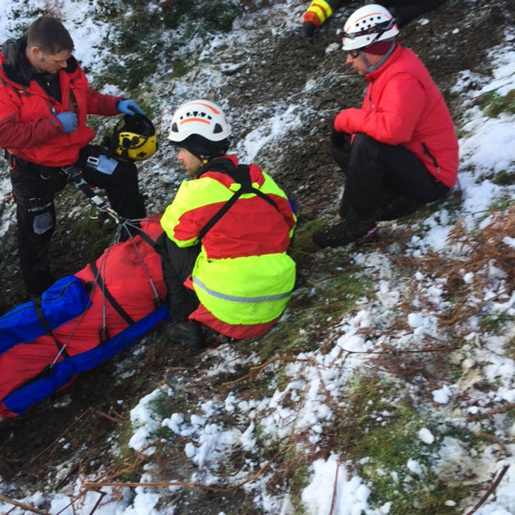 Rescuers with one of the injured off-roaders. Photo: Brecon MRT