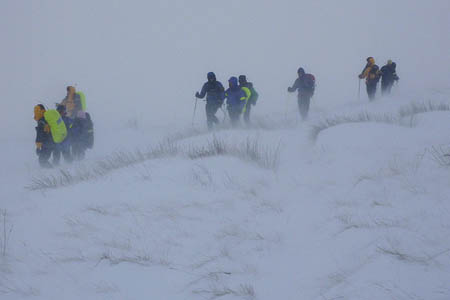 Border Search and Rescue Unit members help competitors from the fells in last year's event. Photo: BSARU