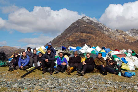 Volunteers with the rubbish collected at Camasunary on Skye, with Blà Bheinn in the background