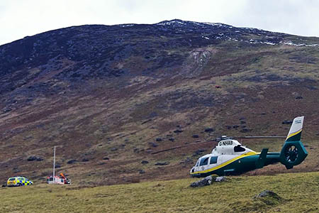The Pride of Cumbria air ambulance at the scene on Carrock Fell. Photo: GNAA The Pride of Cumbria air ambulance at the scene on Carrock Fell. Photo: GNAA