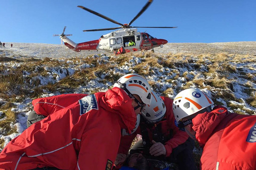 Rescuers with the Coastguard helicopter on Pen y Fan. Photo: Central Beacons MRT