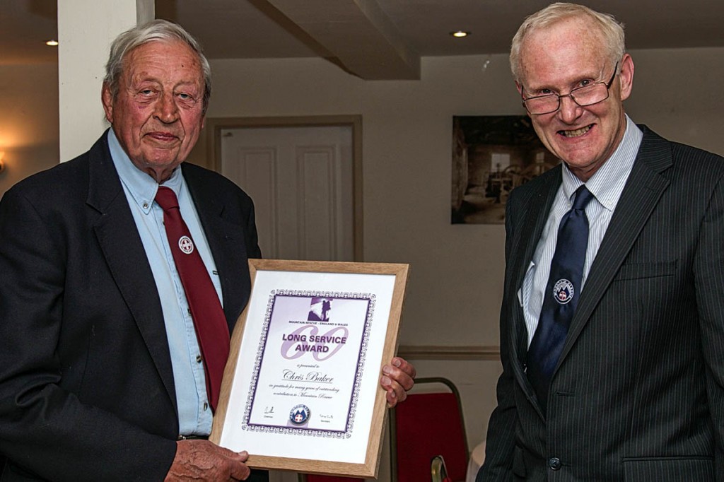 Chris Baker, left, receives his certificate from Peter Bell. Photo: Andy Jackson