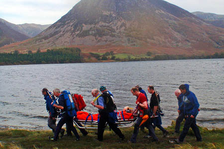 Team members stretcher the woman from the site of the incident Team members stretcher the woman from the site of the incident