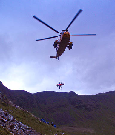 The injured walker is winched into the RAF Sea King at Bleaberry Tarn. Photo: Cockermouth MRT The injured walker is winched into the RAF Sea King at Bleaberry Tarn. Photo: Cockermouth MRT