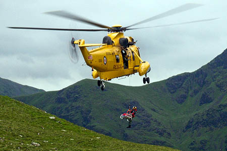 The woman is winched into the RAF Sea King after the rescue on High Crag. Photo: Cockermouth MRT The woman is winched into the RAF Sea King after the rescue on High Crag. Photo: Cockermouth MRT