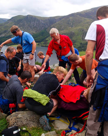 The walker is helped from the fell. Photo: Cockermouth MRT The walker is helped from the fell. Photo: Cockermouth MRT