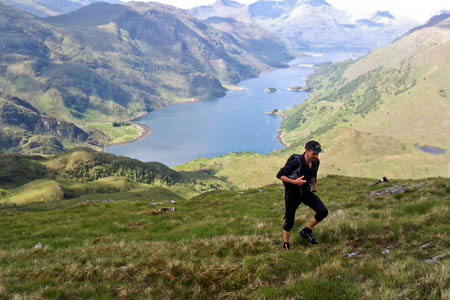 The runner ascends above Loch Hourn